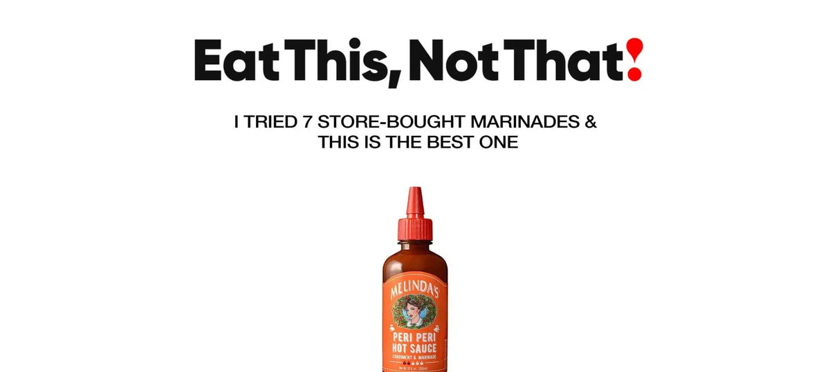 Bottle of Melinda's Peri Peri Hot Sauce condiment & marinade with orange label and red squeeze cap