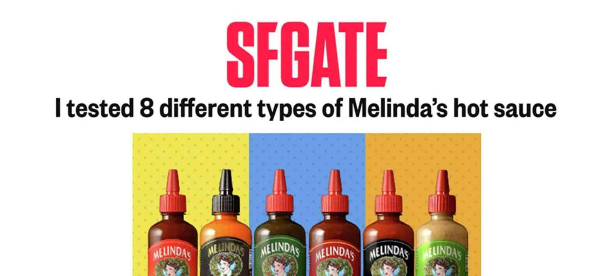 Six bottles of Melinda's hot sauce with different colored labels arranged in a row against colorful background