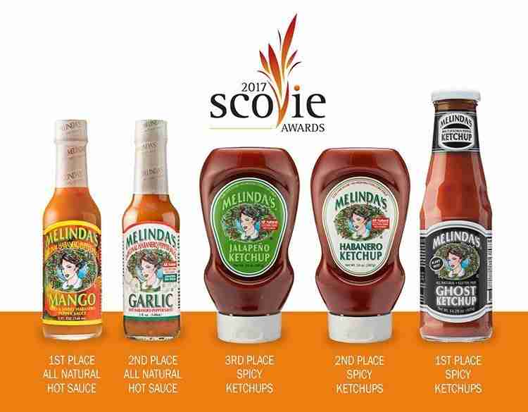Melinda's condiment products displaying 2017 Scovie Awards wins: 1st place mango and ghost pepper sauces, 2nd place...