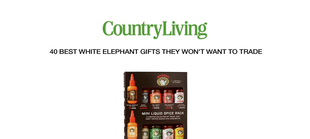 Mini liquid spice rack gift set with hot sauce bottles and spice containers in black packaging