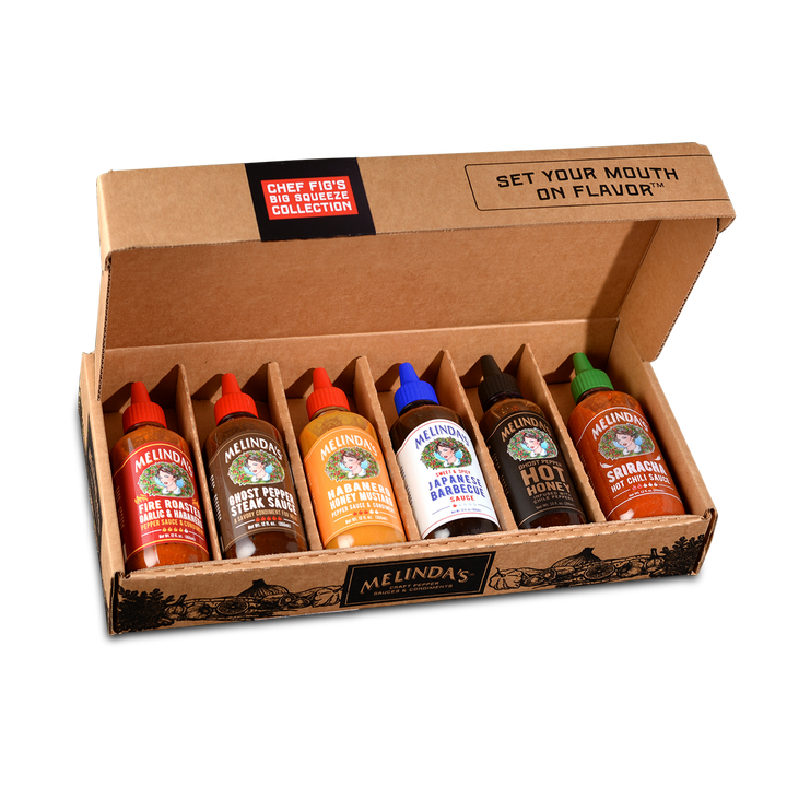 Gift box containing six Melinda's hot sauce bottles with different flavors, arranged in brown cardboard packaging.