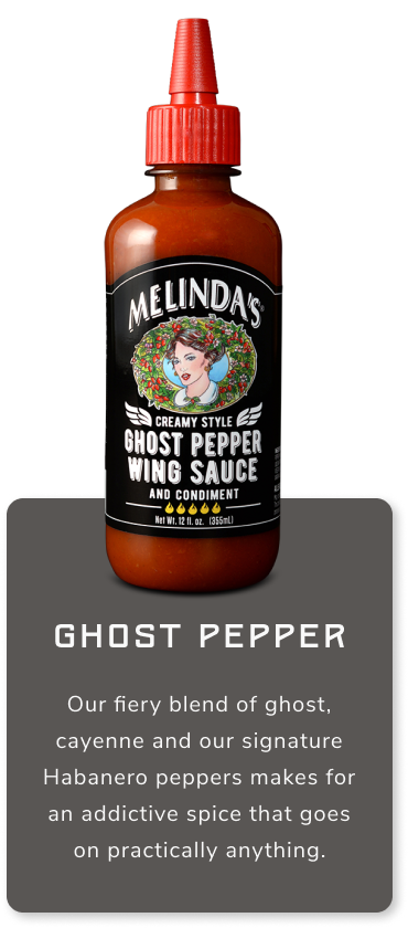 Melinda's Ghost Pepper Wing Sauce bottle with red cap and black label featuring woman's portrait, amber glass container