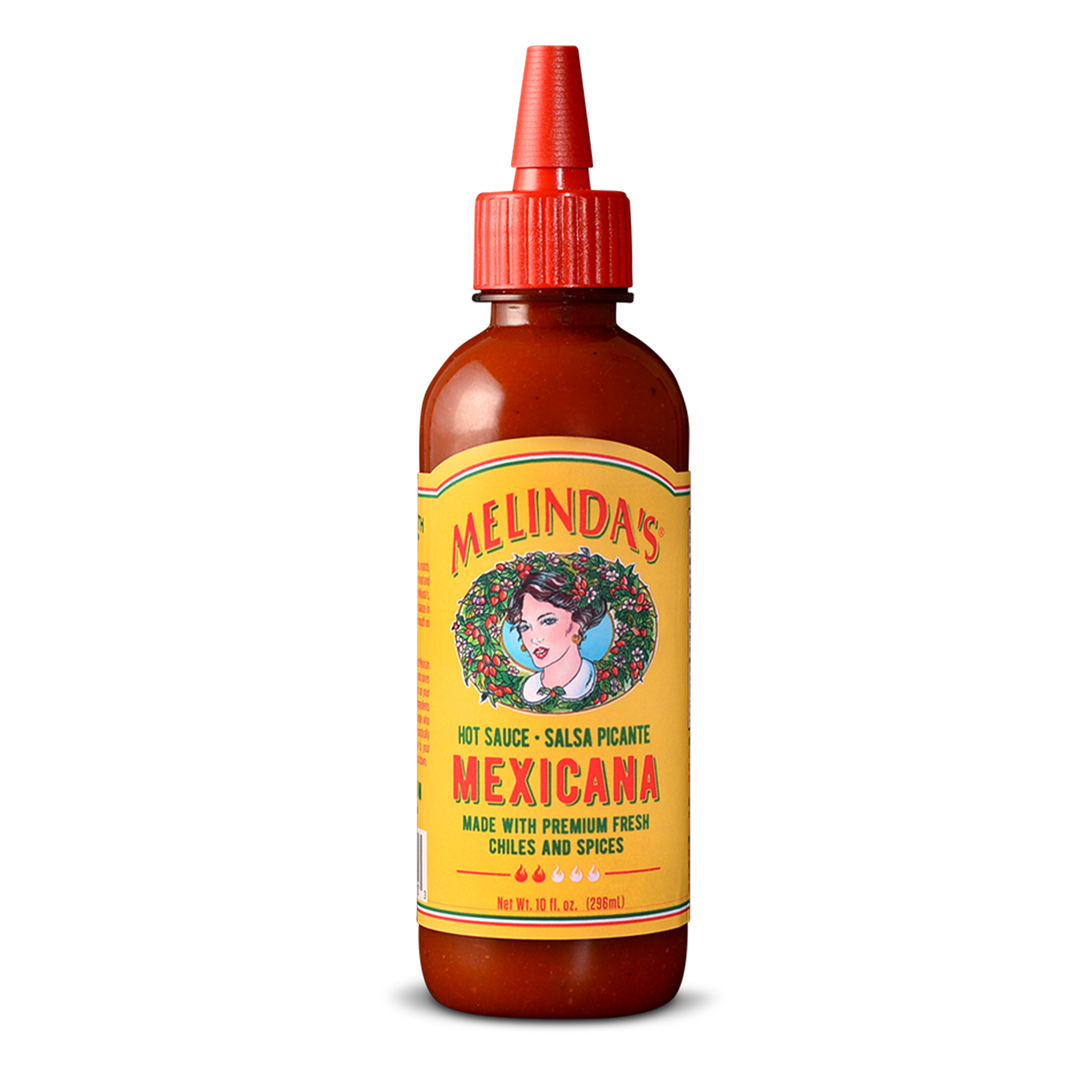 Melinda's Mexicana Hot Sauce bottle with yellow label featuring woman's portrait, red cap, amber glass, 10 fl oz