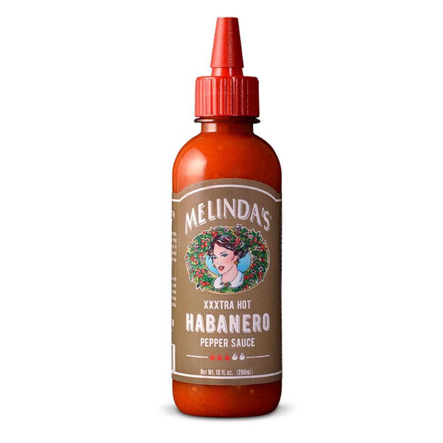 Melinda's XXXtra Hot Habanero Pepper Sauce bottle with red cap and brown label featuring woman's portrait surrounded by...