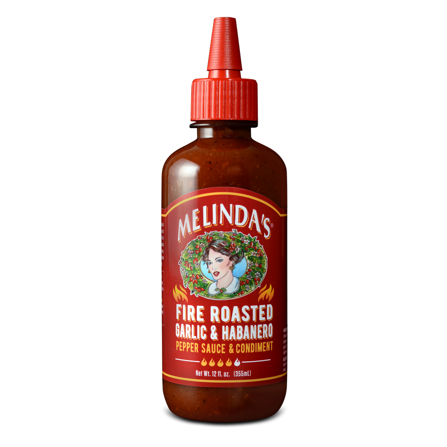 Melinda's Fire Roasted Garlic & Habanero pepper sauce bottle with red label and squeeze cap, 12 fl oz