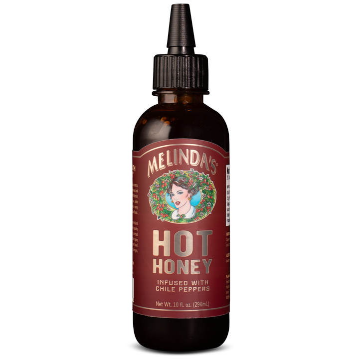 Melinda's Hot Honey sauce bottle with dropper cap, infused with chile peppers, 10 fl oz, amber glass bottle