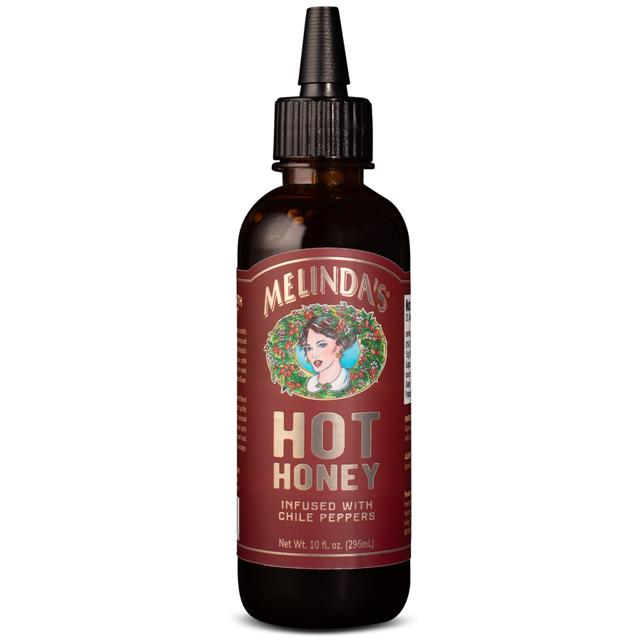 Melinda's Hot Honey sauce bottle with dropper cap, infused with chile peppers, 10 fl oz, amber glass bottle