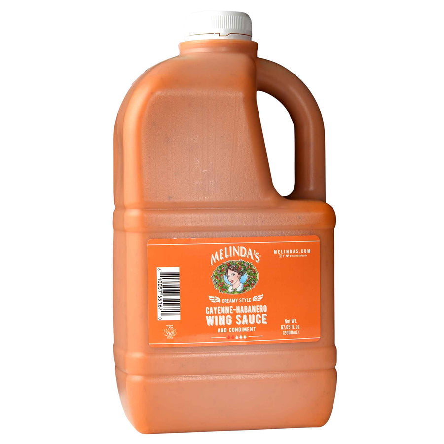Large orange plastic jug of Melinda's Creamy Style Cayenne-Habanero Wing Sauce with white cap and orange label