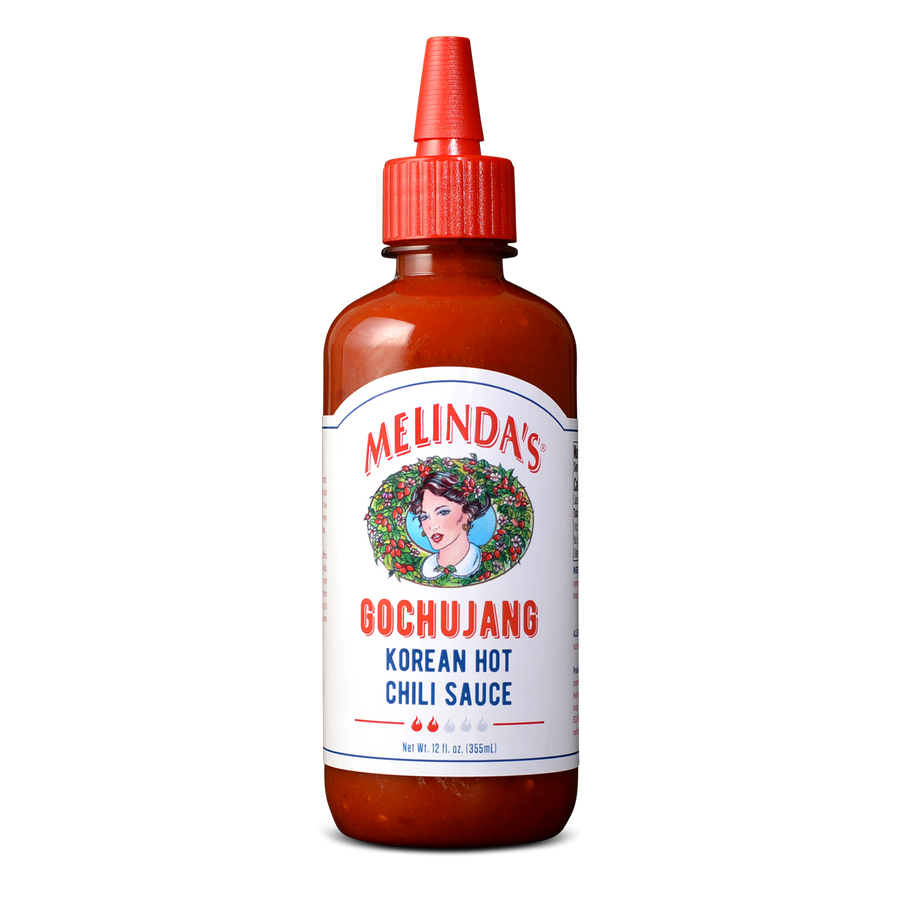 Melinda's Gochujang Korean Hot Chili Sauce bottle with red cap and white label featuring woman's portrait in wreath