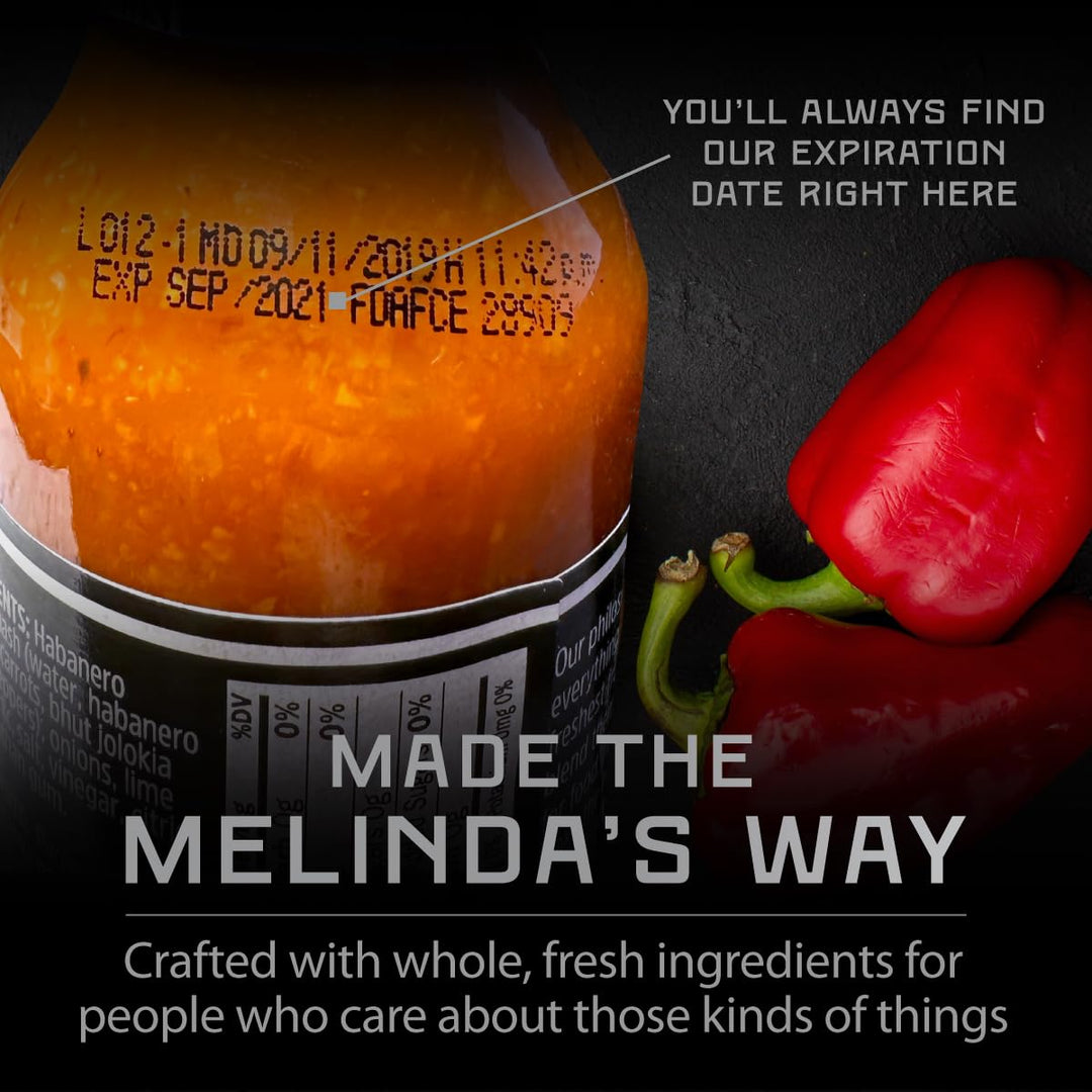Melinda's hot sauce bottle with expiration date visible, next to red bell pepper, with text "Made the Melinda's Way"