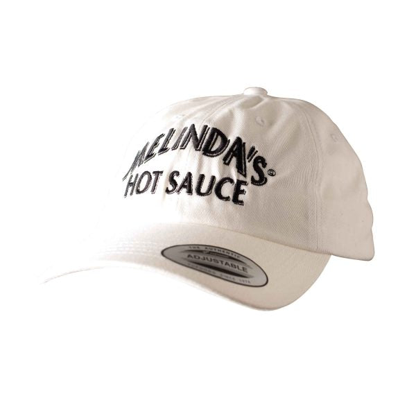 White baseball cap with black embroidered "MELINDA'S HOT SAUCE" text on front panel