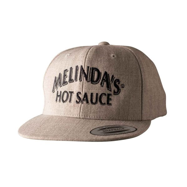 Tan snapback baseball cap with "MELINDA'S HOT SAUCE" embroidered in black letters on front panel