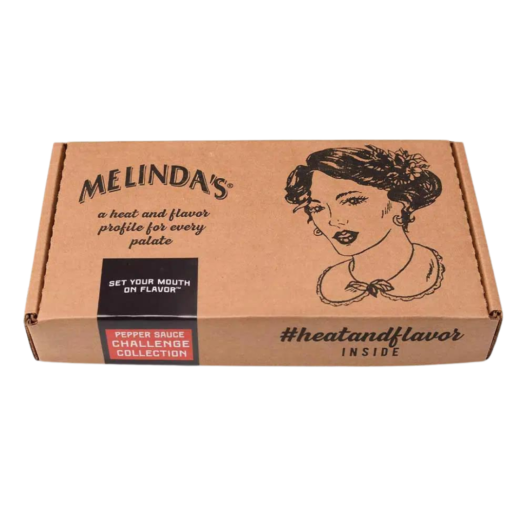 Melinda's brown cardboard box featuring vintage-style woman illustration, "Pepper Sauce Challenge Collection" label