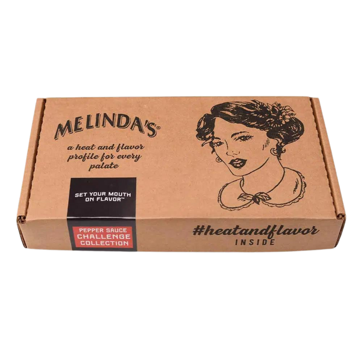 Melinda's brown cardboard box featuring vintage-style woman illustration, "Pepper Sauce Challenge Collection" label