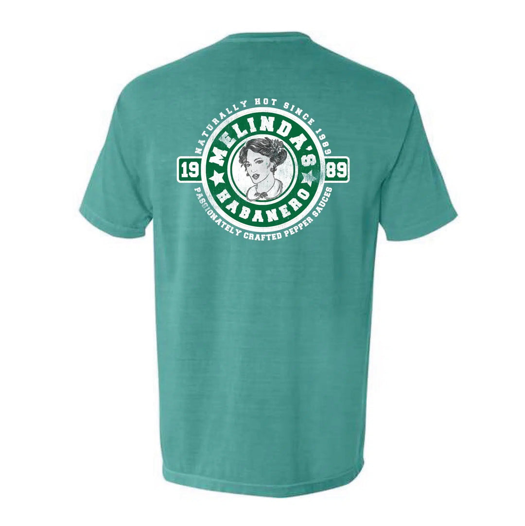 Green t-shirt with Melinda's Habanero hot sauce logo featuring woman's portrait, text "Naturally Hot Since 1989"