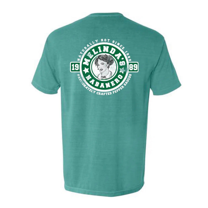 Green t-shirt with Melinda's Habanero hot sauce logo featuring woman's portrait, text "Naturally Hot Since 1989"