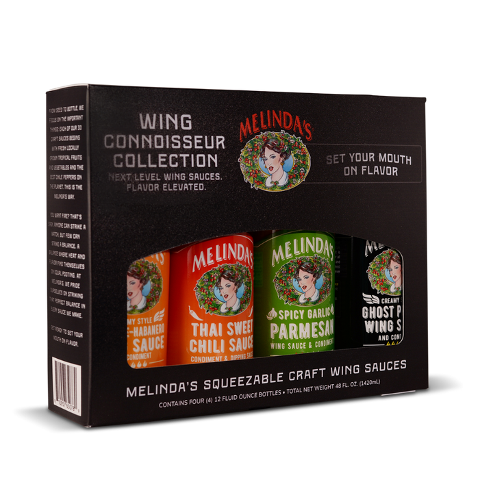 Melinda's Wing Connoisseur Collection gift box containing four 12oz squeeze bottles of craft wing sauces in black packaging
